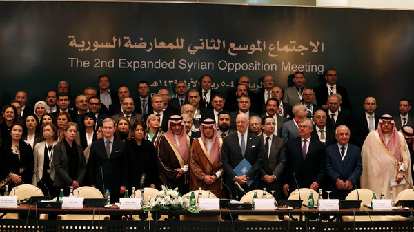 Saudi Foreign Minister Adel al-Jubeir poses for a group photo during a Syrian opposition meeting in Riyadh, Saudi Arabia